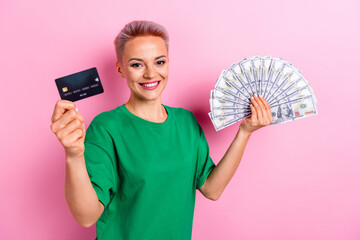 Photo of rich wealthy woman hold cash bank debit plastic card deposit nfc transaction isolated on...