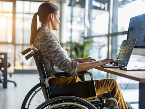 A person with a motor disability working in an inclusive workplace