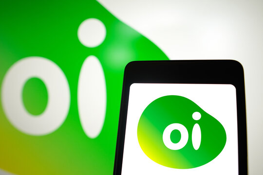 February 28, 2024, Brazil. In this photo illustration, the Oi logo is displayed on a smartphone screen and in the background.