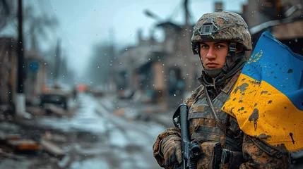 Foto auf Acrylglas Ukrainian military holds the flag of Ukraine. The concept of victory. © Vasiliy
