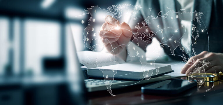 Businesswoman working with currency exchange in office.