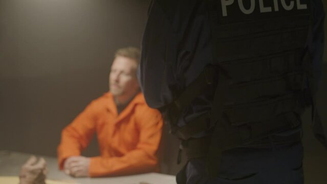 Police interrogation in a smoke filled room with an inmate