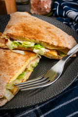 Tortilla multigrain with omelette, lettuce and ham.