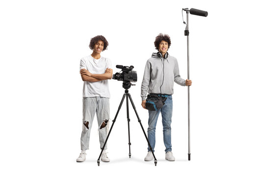 Boom and camera operators holding a microphone and smiling