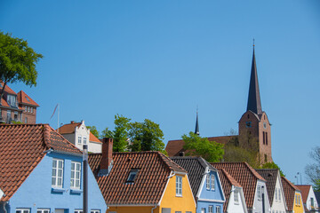 Colorful houses and the St. Marie church in the Danish city of Sønderborg