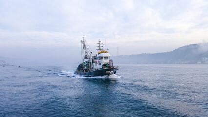 A fishing boat hunting in the open sea.