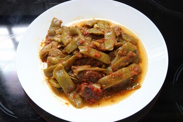 Slow-cooked green beans in rich tomato sauce