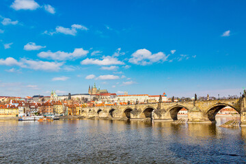 View of Charles Bridge, Prague Castle and Vltava river in Prague, Czech Republic during summer spring day