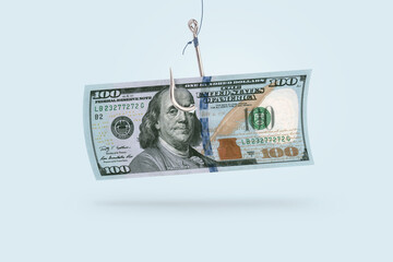100 dollars on a hook, creative idea. Business and scam projects, concept. Scammers