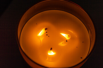 burning candle in the dark