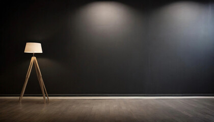Create your own space in this empty room with a black wall, lamp, and wooden floor. - obrazy, fototapety, plakaty