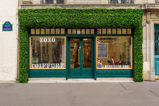 paris France 13 march 2023 : french style restaurant and shop facade , traditional parisian boutique