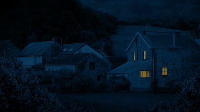 Lights Come On In Two Rooms Of House At Night Rural Area