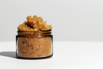 brown sugar scrub on white background, empty copy space, minimalism, simple, advertisment