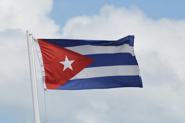 Cuban flag waving on top of a flagpole