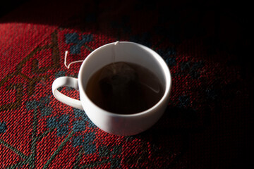 cup of coffee on red background