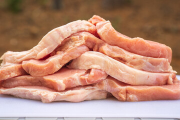 Background of raw pork tenderloins for barbecue. The meat has natural colors, not too much red to...