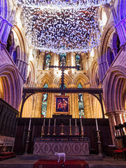 Hexham Abbey interior with origami stars and a lamb.