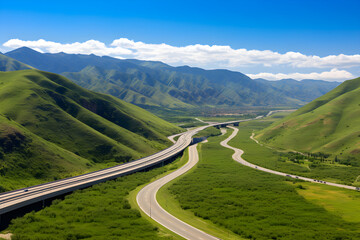 Fototapeta na wymiar Breathtaking Panoramic View of the Greenery Hugged AA Highway Under Clear Blue Sky
