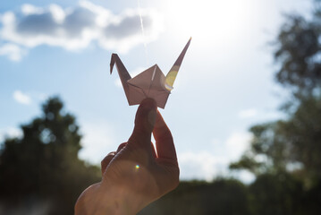 hand holding a paper origami