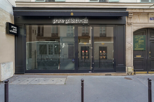 Paris France 5 may 2023 : traditional retro french fashion store facade , black painted