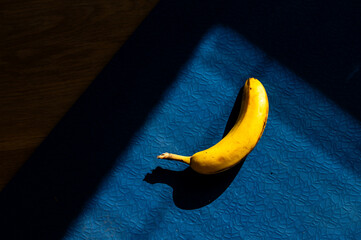 Sunlit banana adorning the kitchen countertop