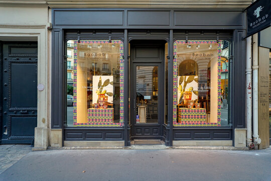 Paris France ,6 july 2023  : typical vintage french boutique , black painted storefront