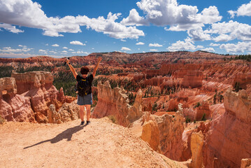 Middle-aged woman taking in the vistas in Bryce Canyon National Park, Utah.