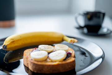 Well-balanced morning: A nutritious breakfast spread with a banana and whole-grain bread - 747564968