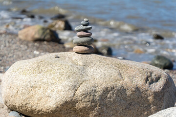 Cairns, stacked stones on the Baltic Sea coast, traditional marking for hikers