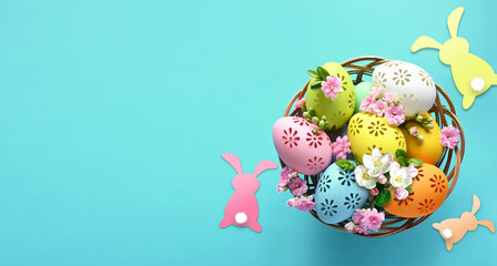 Collection of stylish colors eggs with flowers for Easter celebration on blue background. - 747566719
