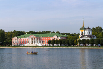 Kuskovo palace and the Church of the All-Merciful Savior in Kuskovo, Moscow. - obrazy, fototapety, plakaty