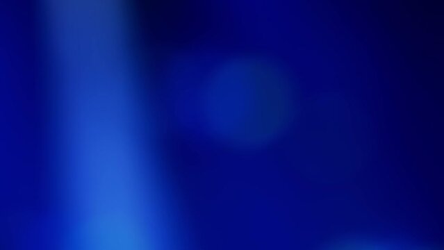 Abstract blurred background with fast moving green and blue lights, flashing like at a music concert. Real time video.