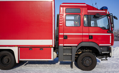 Abstract Detail of Fire Truck Side Panel in Aachener Weiher, Cologne: Vibrant Red Texture Against Snow
