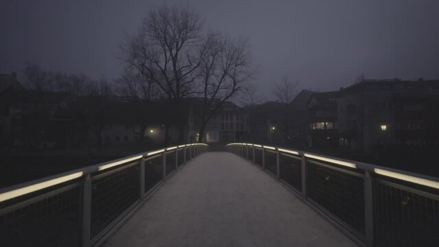 Illuminated bridge in the fog