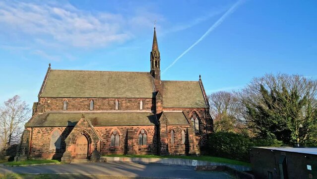Drone shot of St Mary's Church at sunset in Halton village in the town of Runcorn, Cheshire, England