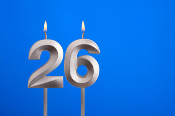 Birthday candle number 26 - Celebration card on blue background
