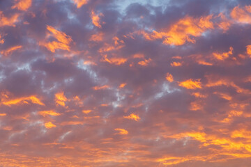 Abstract sunset clouds and sky nature background featuring vibrant colorful clouds at dusk