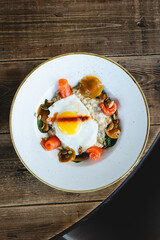 Hearty breakfast with eggs, porridge and salmon. Healthy lifestyle, lunch, brunch