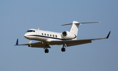 Light private jet comes in for a landing. High quality photo
