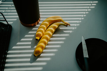 Natural radiance showcases a banana on the kitchen tabletop