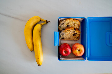 Banana, apples, and banana bread ready for school or work