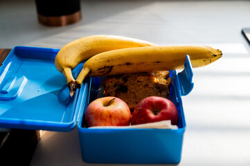Packaged banana, apples, and banana bread, perfect for school or work
