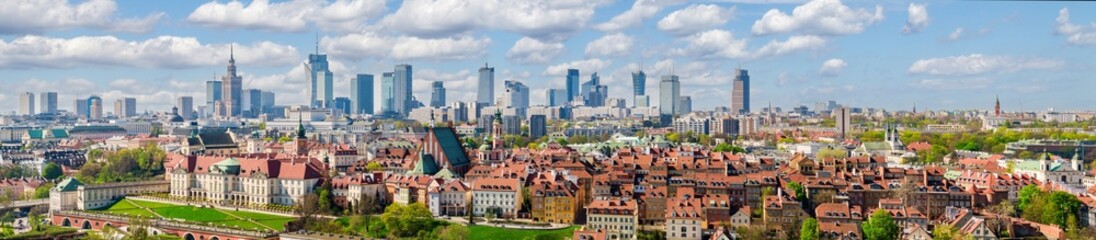 Fototapeta premium Warsaw old town and distant city center, PKiN and skyline under blue cloudy sky aerial landscape