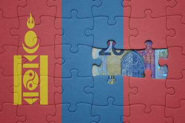 puzzle with the national flag of mongolia and euro banknote. finance concept