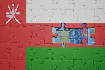 puzzle with the national flag of oman and euro banknote. finance concept