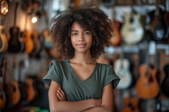 An aspiring musician smiles gently, surrounded by an assortment of hanging guitars.