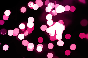 Pink defocused bokeh lights  blur sparkling background Shining lights Party sparks glowing soft...