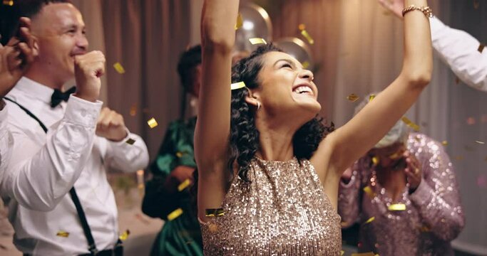 Business people, dancing and new year celebration with confetti at party, happy or excited in night. Men, women and smile with sparkle, gold and silver glitter for cheers at gala, fashion or friends