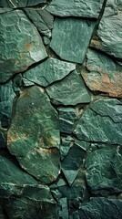 A stone wall with a textured surface displaying shades of green and brown colors. The wall presents a rugged and weathered appearance, showcasing a harmonious blend of earthy tones.